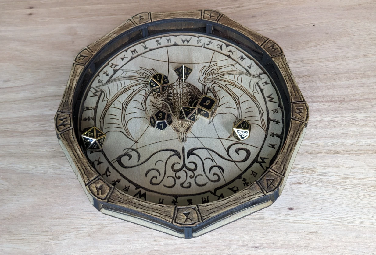Handcrafted wooden dice trays for rolling and organising dice during tabletop role-playing games.