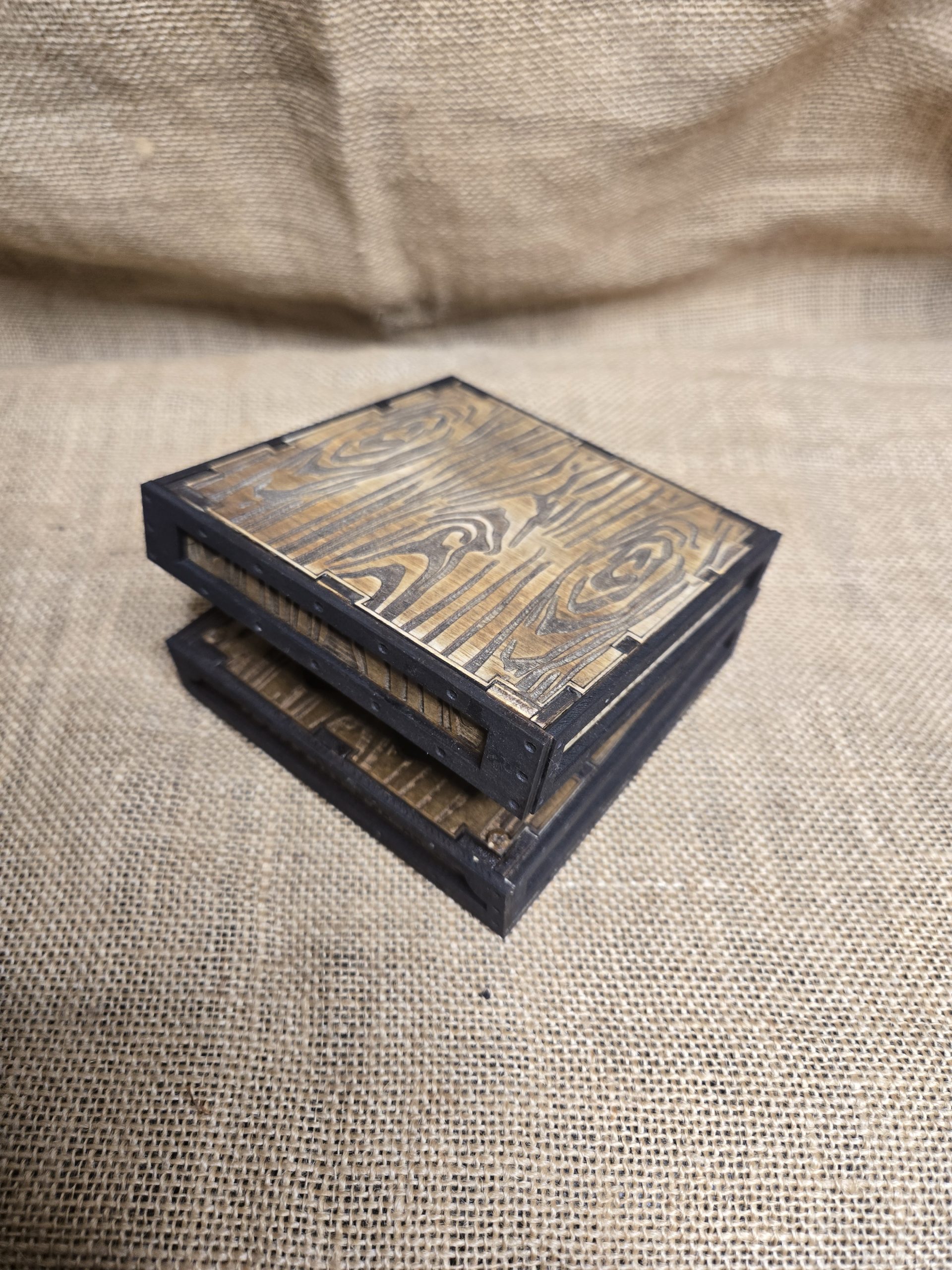 Natural wood grain dice box designed to hold a full set of polyhedral tabletop gaming dice.