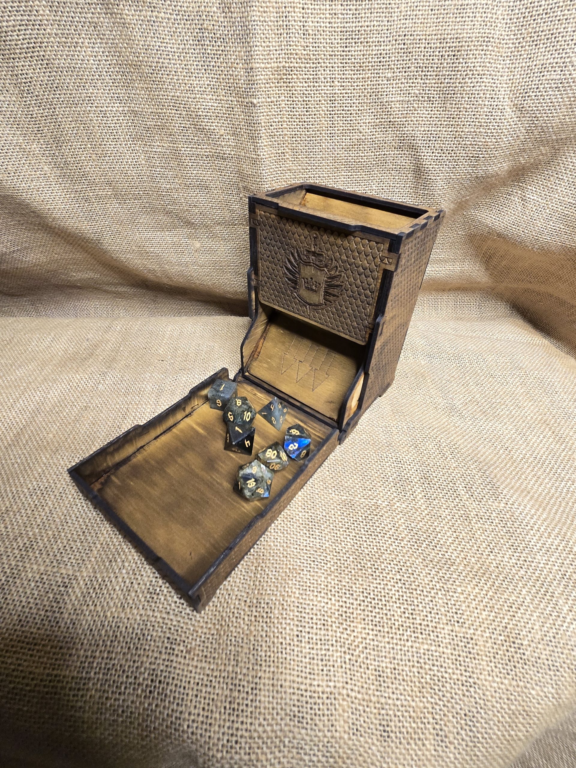 Folding wooden castle-style dice tray with labradorite dice, designed to contain rolls during gameplay.