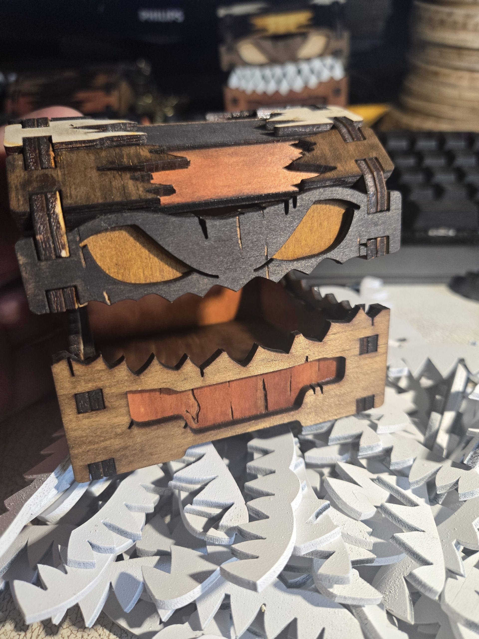 Work-in-progress wooden mimic chest with a rounded mouth design, shown without teeth or eyes during the production process.