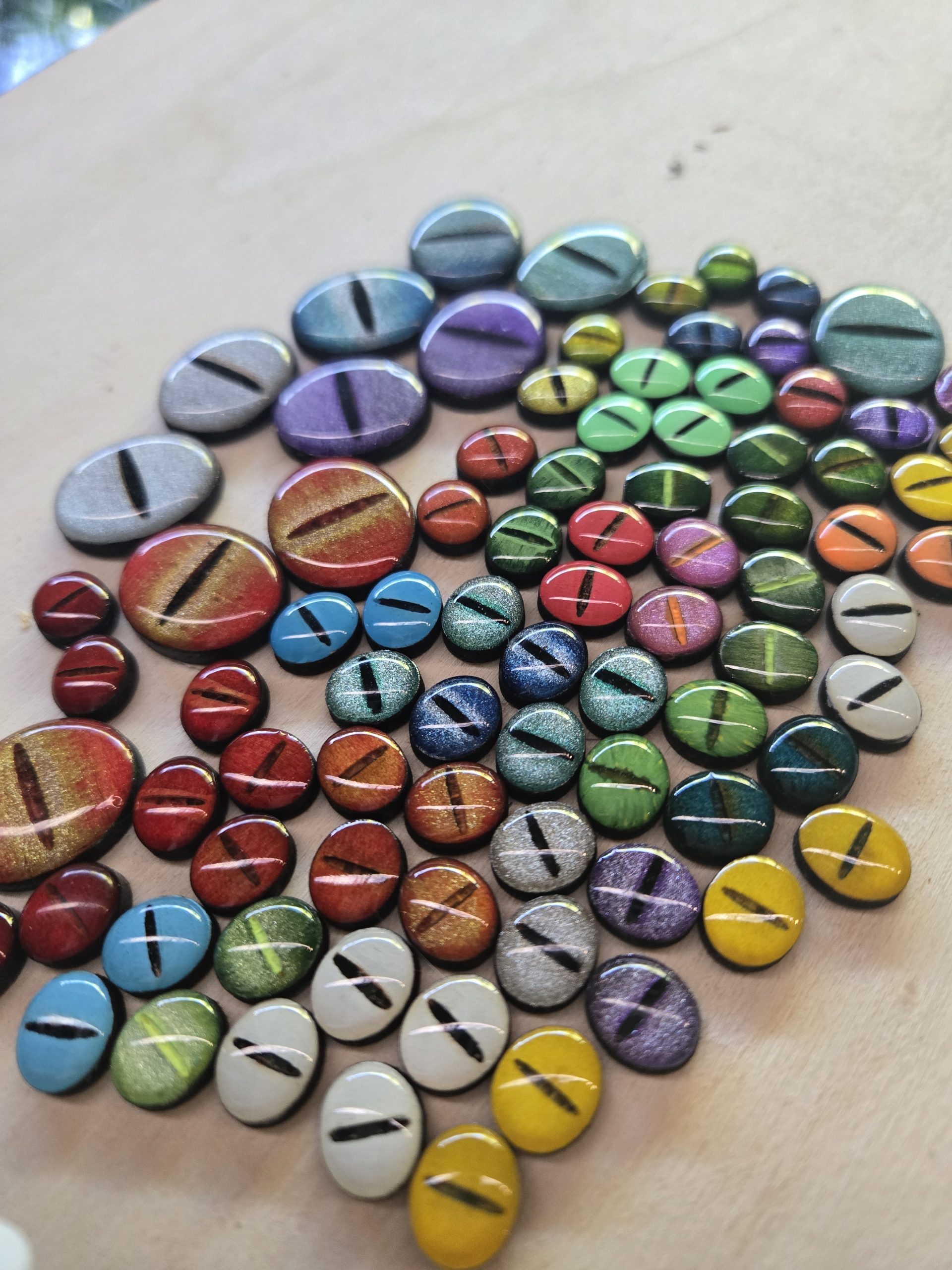 Wooden mimic eyes prepared for use in mimic chests, dice towers, earrings and fantasy keyrings.