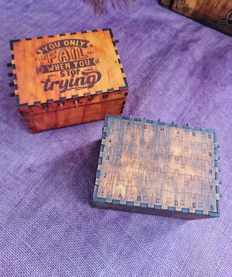 Reusable 42-step wooden puzzle boxes designed as a challenging hands-on puzzle, taking approximately 10–15 minutes to solve once familiar.