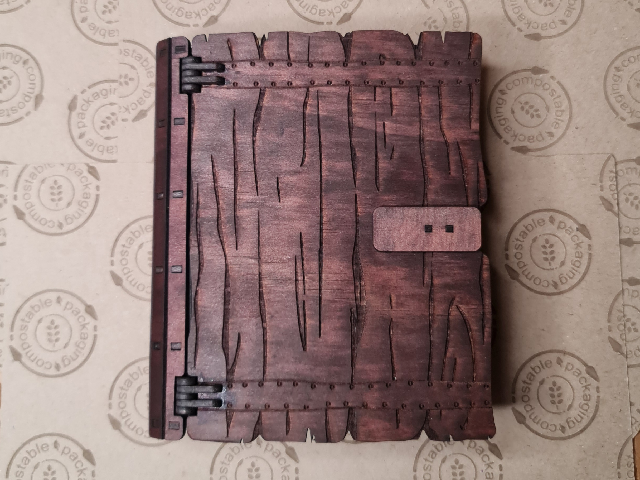 Handcrafted wooden book box with natural wood grain finish, designed for fantasy storage and tabletop accessories.